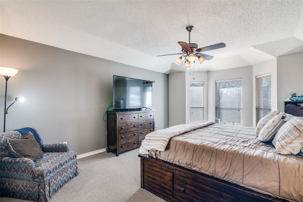 3214 Chalkstone Drive Rowlett, TX 75088 - Photo 21 of 36 View of primary bedroom with ceiling fan, sitting area and bay windows.