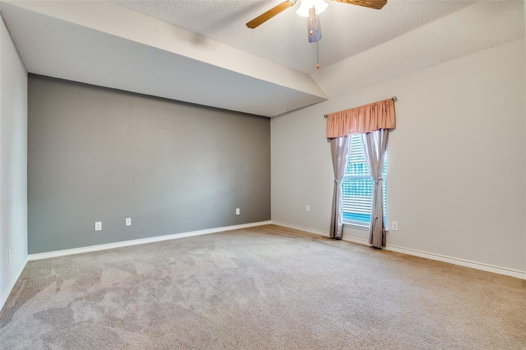 3214 Chalkstone Drive Rowlett, TX 75088 - Photo 26 of 36 Downstairs bedroom off the kitchen area has an ensuite bath encluded.