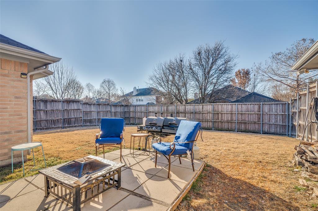 3214 Chalkstone Drive Rowlett, TX 75088 - Photo 33 of 36 Enjoy entertaining out on the patio overlooking sizable back yard.
