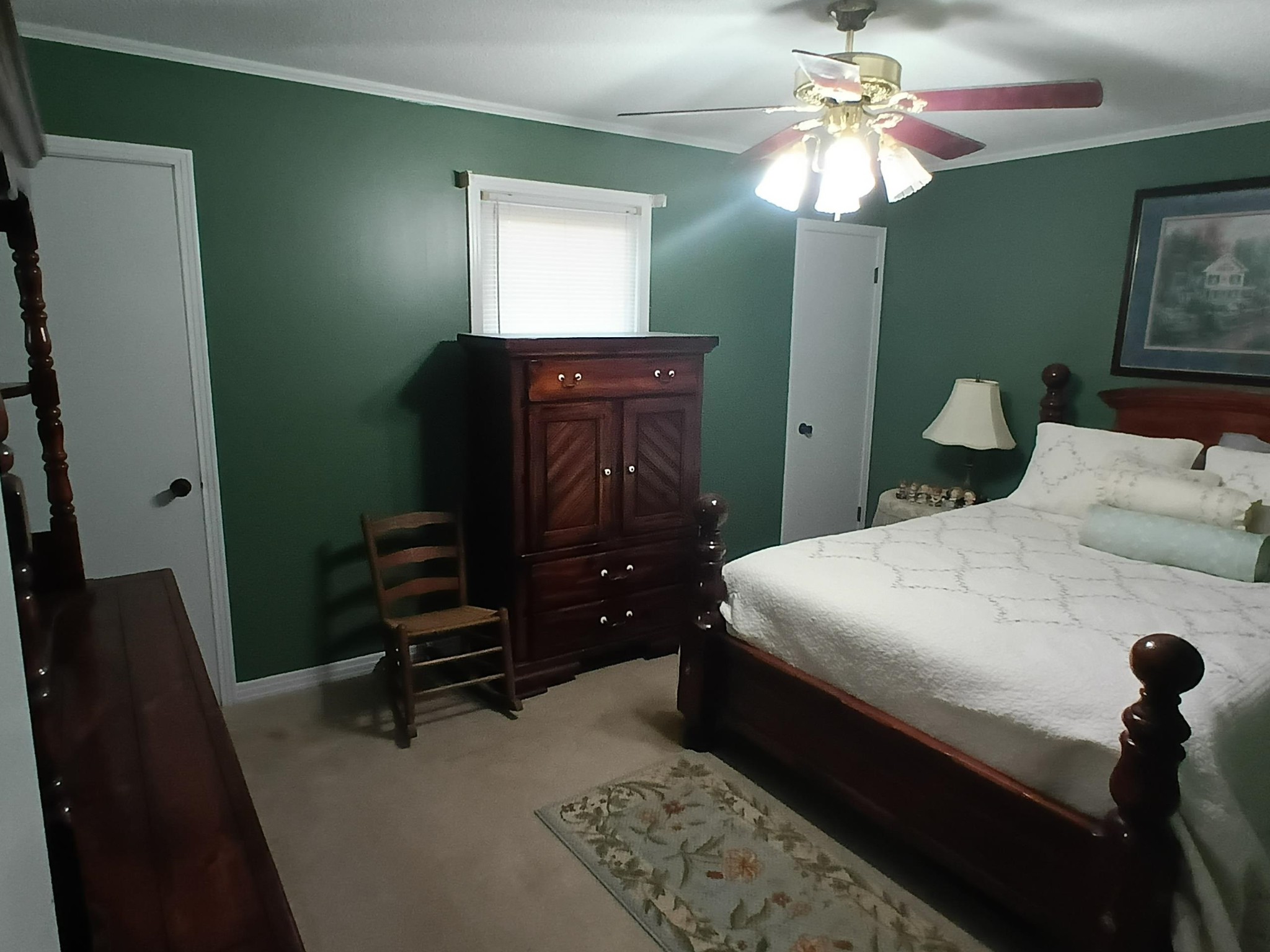 540 Willoughby Loop Savannah, TN 38372 - Photo 23 of 25 a bedroom with a bed and a mirror on dresser