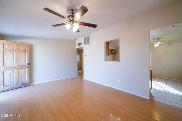 a view of an empty room with a window