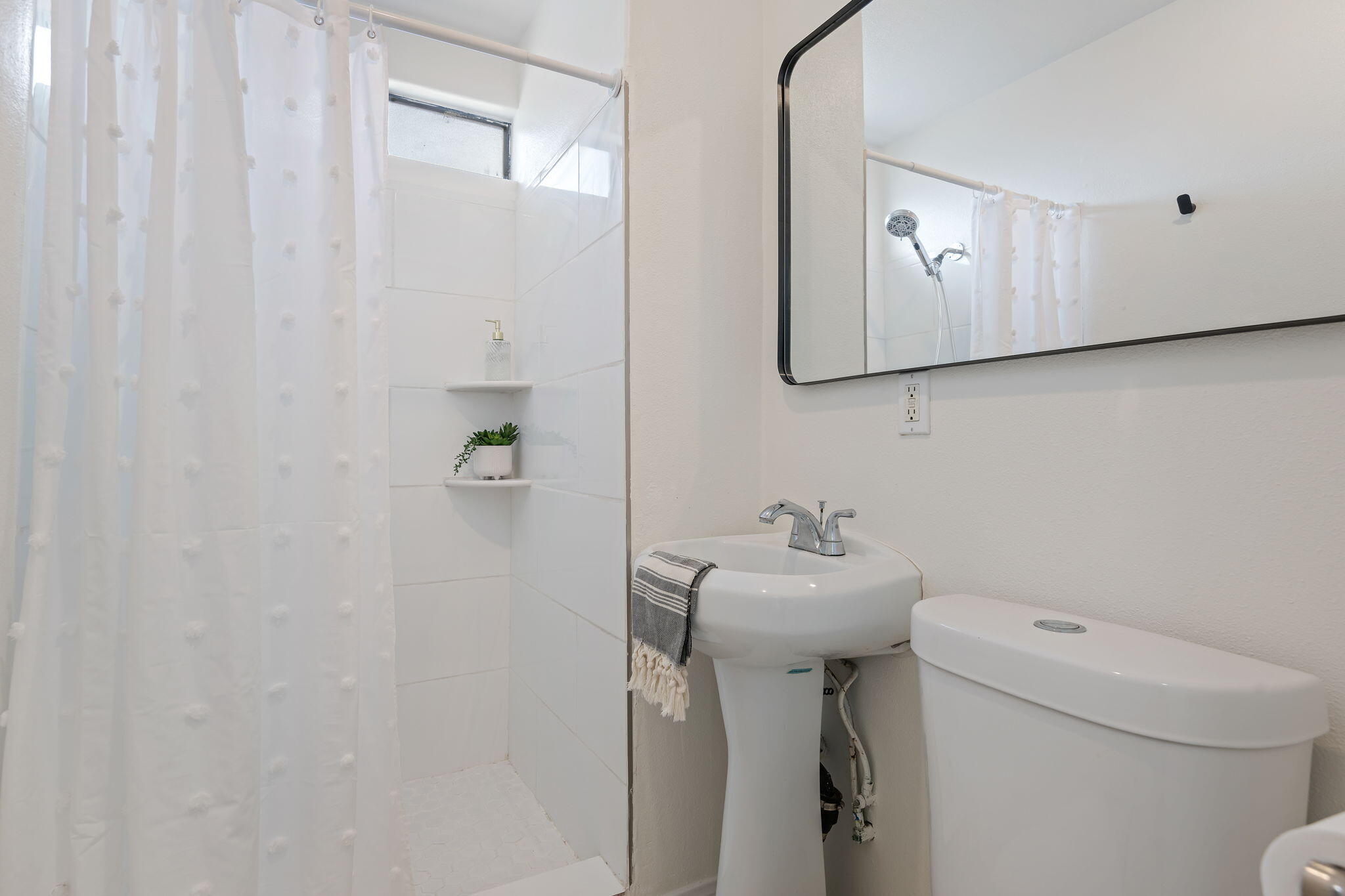 4200 South A Street Oxnard, CA 93033 - Photo 12 of 23 a bathroom with a sink a toilet and mirror