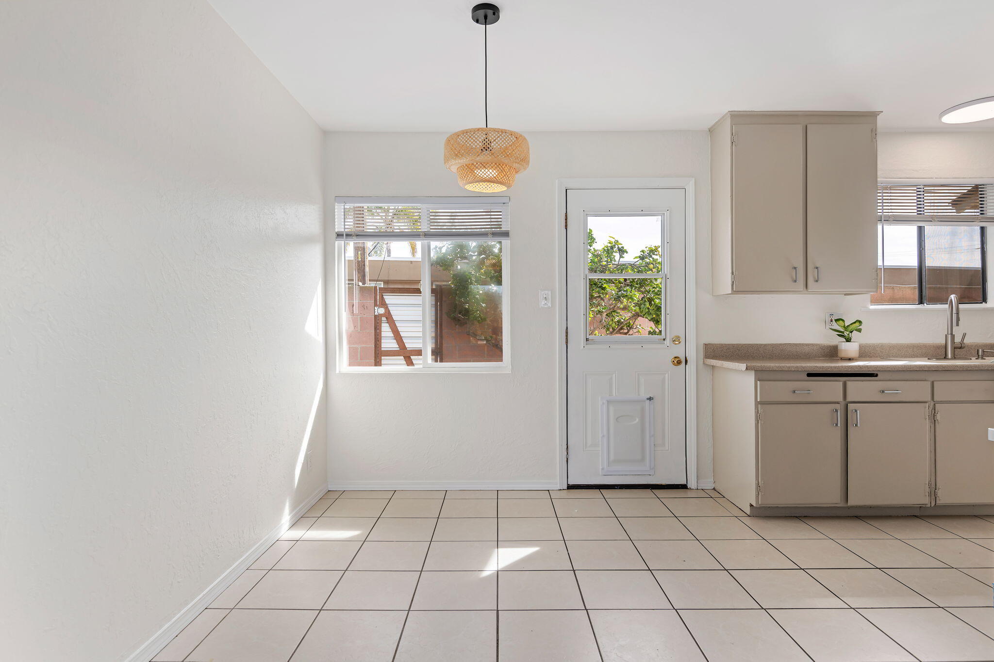 4200 South A Street Oxnard, CA 93033 - Photo 6 of 23 a kitchen with white cabinets and window