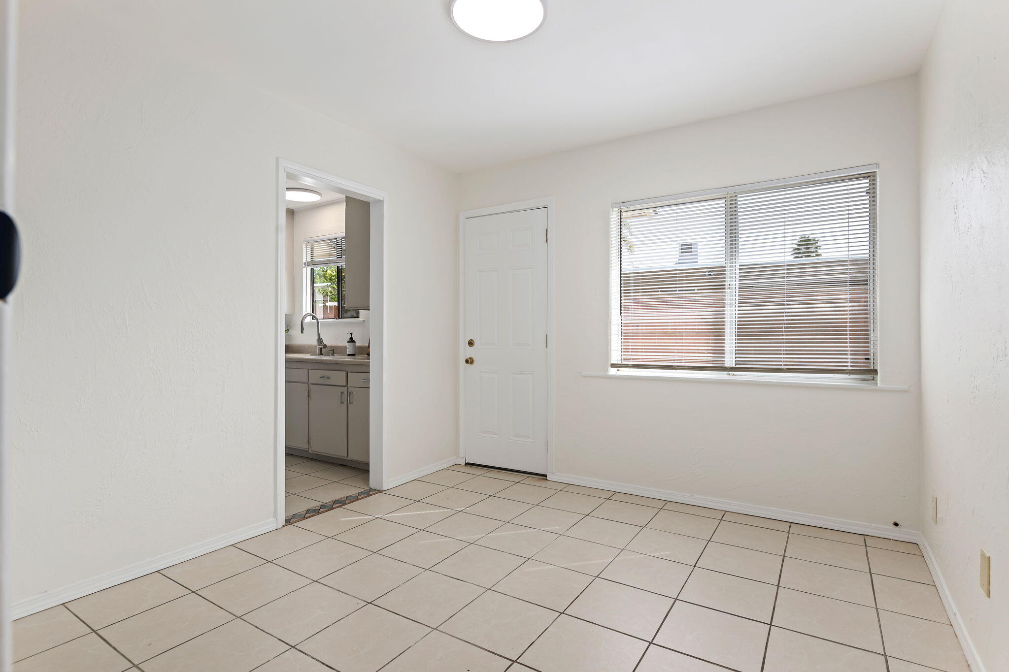 4200 South A Street Oxnard, CA 93033 - Photo 9 of 23 a view of an empty room with window and cabinet