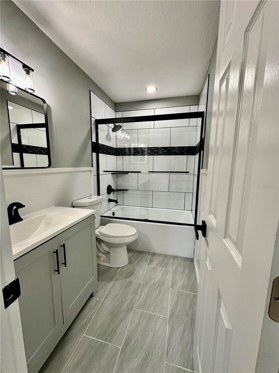 460 Base Avenue East, Unit 129 Venice, FL 34285 - Photo 14 of 33 a bathroom with a sink a toilet and shower