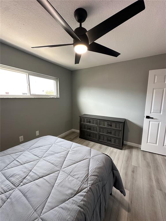 460 Base Avenue East, Unit 129 Venice, FL 34285 - Photo 19 of 33 a bedroom with a bed and a window