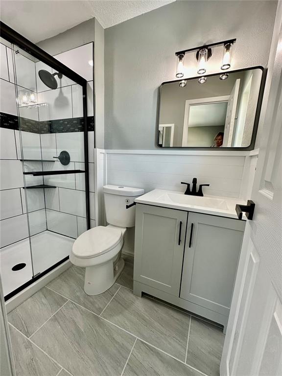 460 Base Avenue East, Unit 129 Venice, FL 34285 - Photo 21 of 33 a bathroom with a toilet sink and mirror