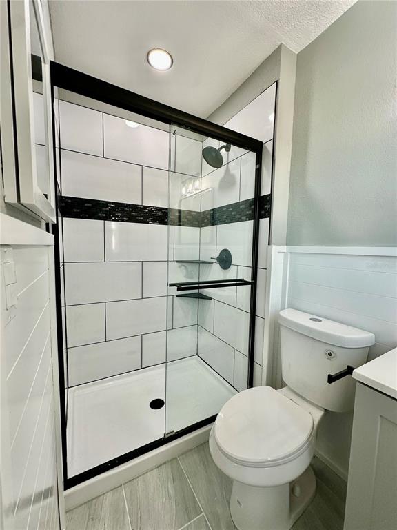 460 Base Avenue East, Unit 129 Venice, FL 34285 - Photo 22 of 33 a bathroom with a toilet and a shower