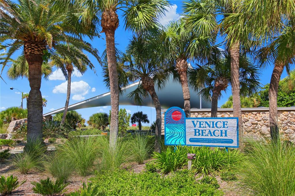 460 Base Avenue East, Unit 129 Venice, FL 34285 - Photo 26 of 33 a view of sign board and tall tree
