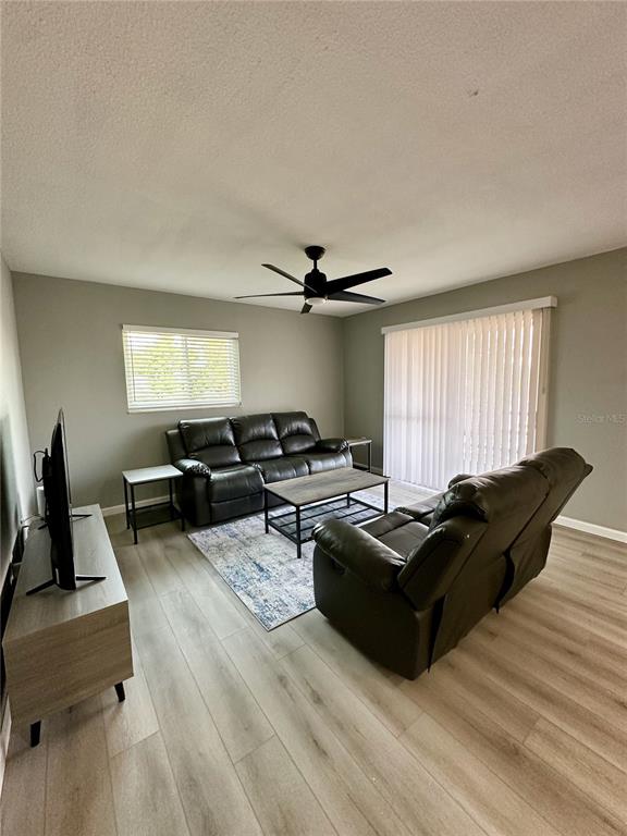 460 Base Avenue East, Unit 129 Venice, FL 34285 - Photo 8 of 33 a living room with furniture window and a table