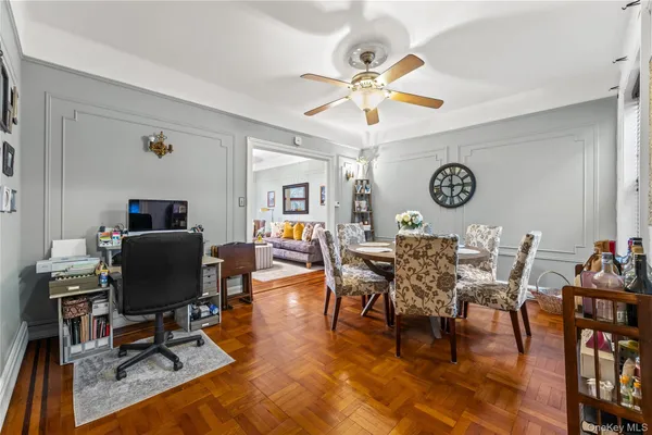 a view of a livingroom with furniture and a window
