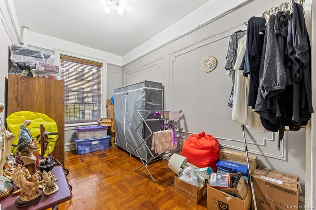 a view of a livingroom with furniture and gym equipment