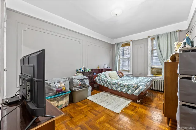 a bedroom with bed and a window