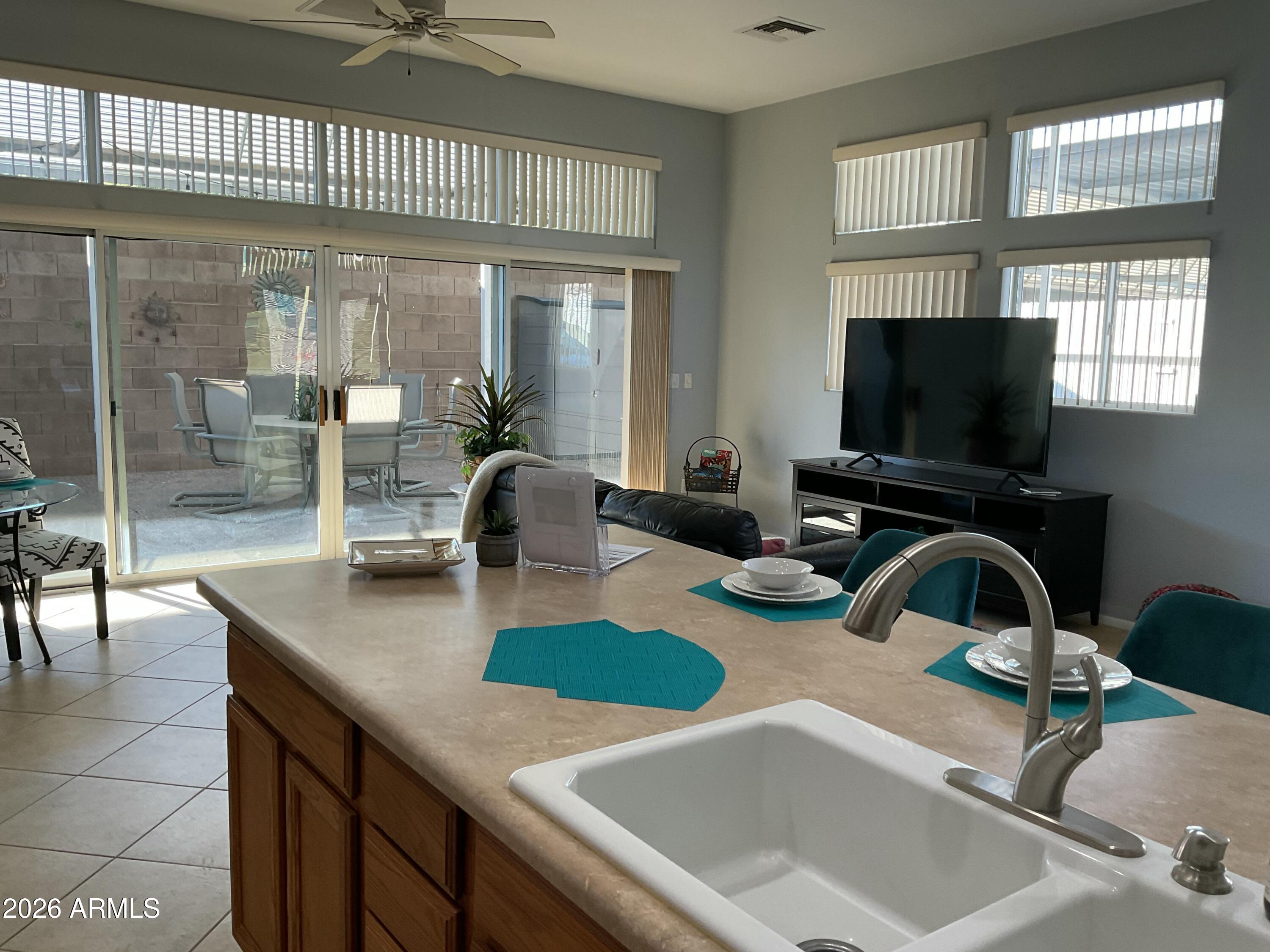 17200 West Bell Road, Unit 1770 Surprise, AZ 85374 - Photo 13 of 36 a kitchen with sink and a large window
