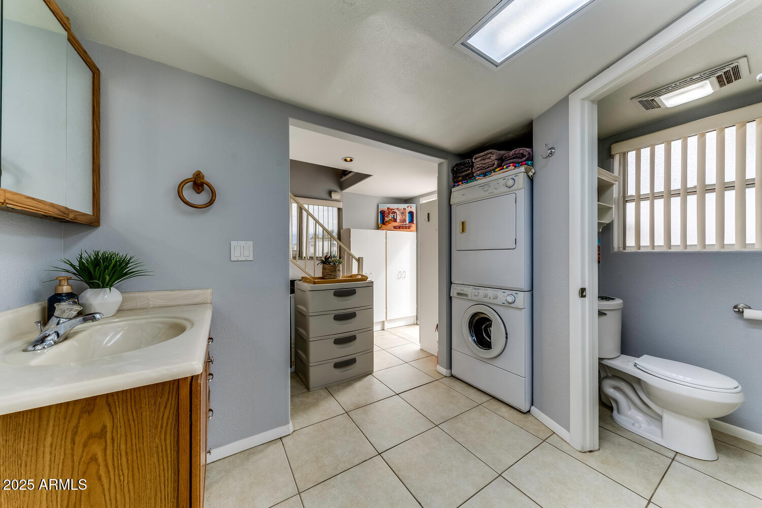 17200 West Bell Road, Unit 1770 Surprise, AZ 85374 - Photo 17 of 36 a bathroom with a toilet and a sink
