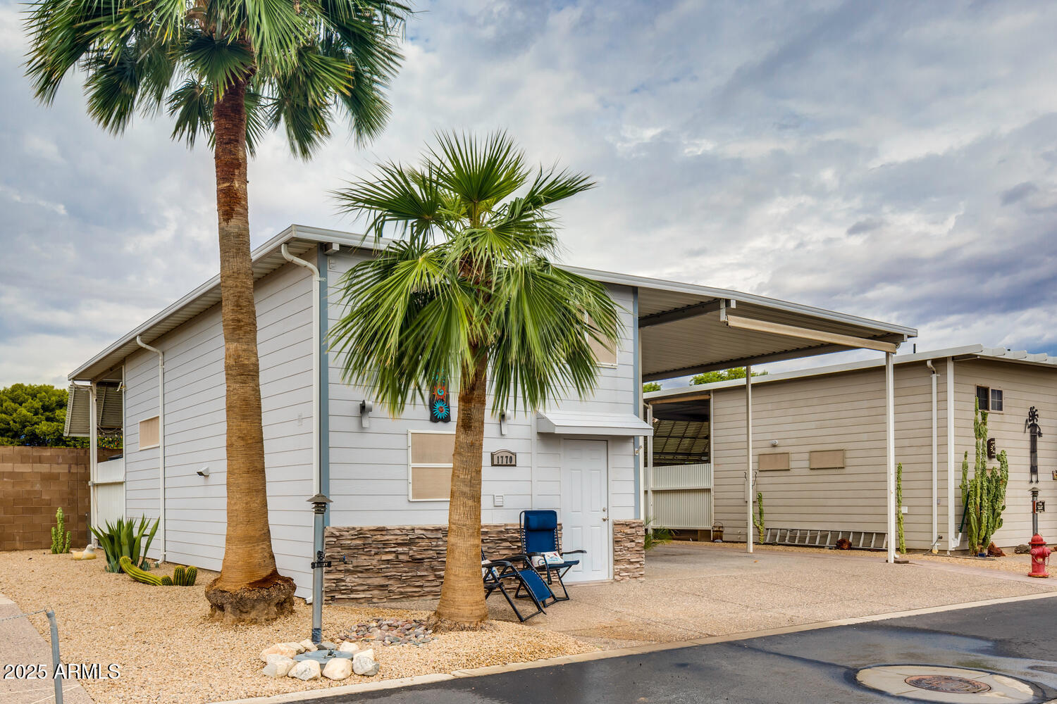 17200 West Bell Road, Unit 1770 Surprise, AZ 85374 - Photo 2 of 36 a front view of house with yard and trees around