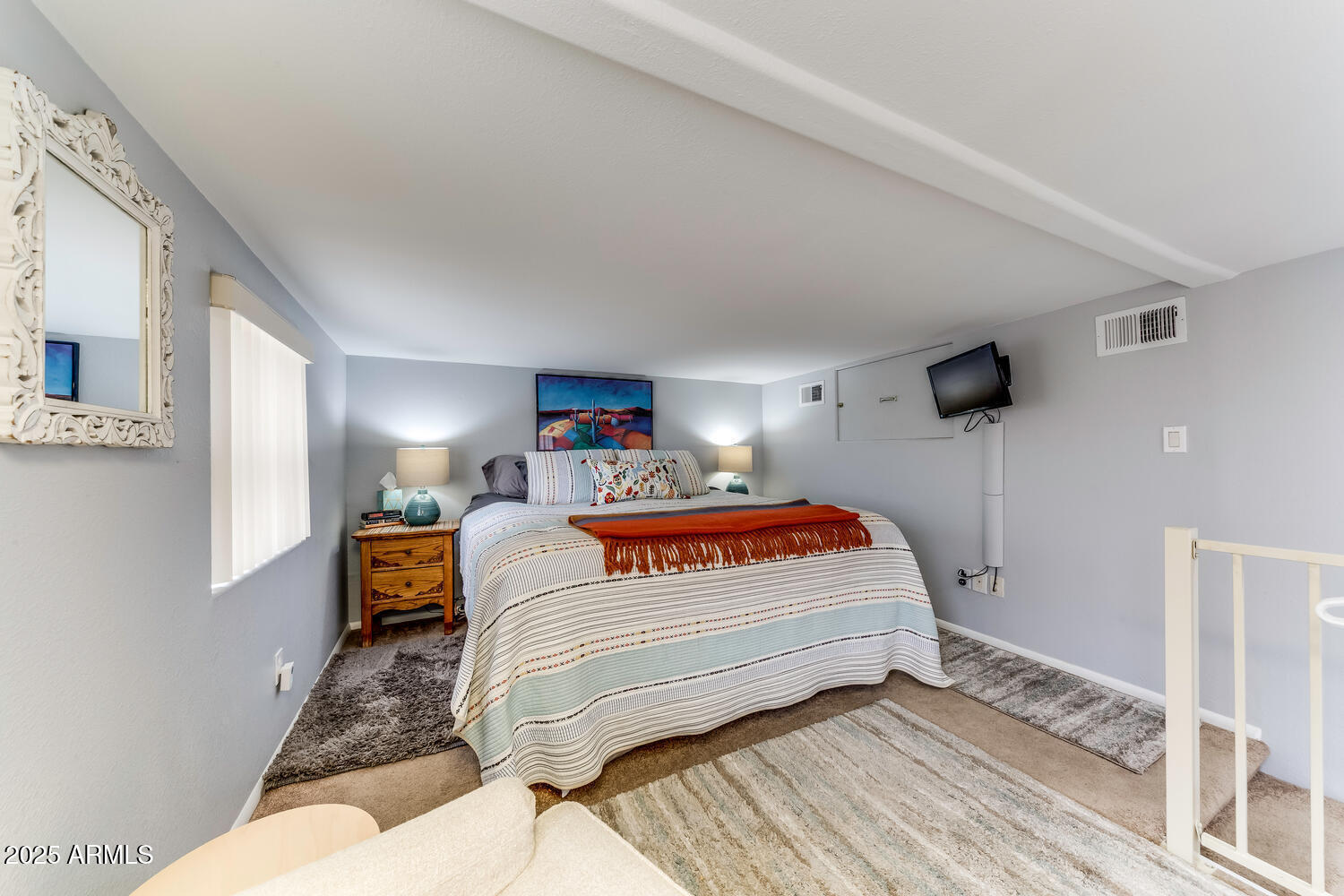 17200 West Bell Road, Unit 1770 Surprise, AZ 85374 - Photo 21 of 36 a bedroom with a bed and window