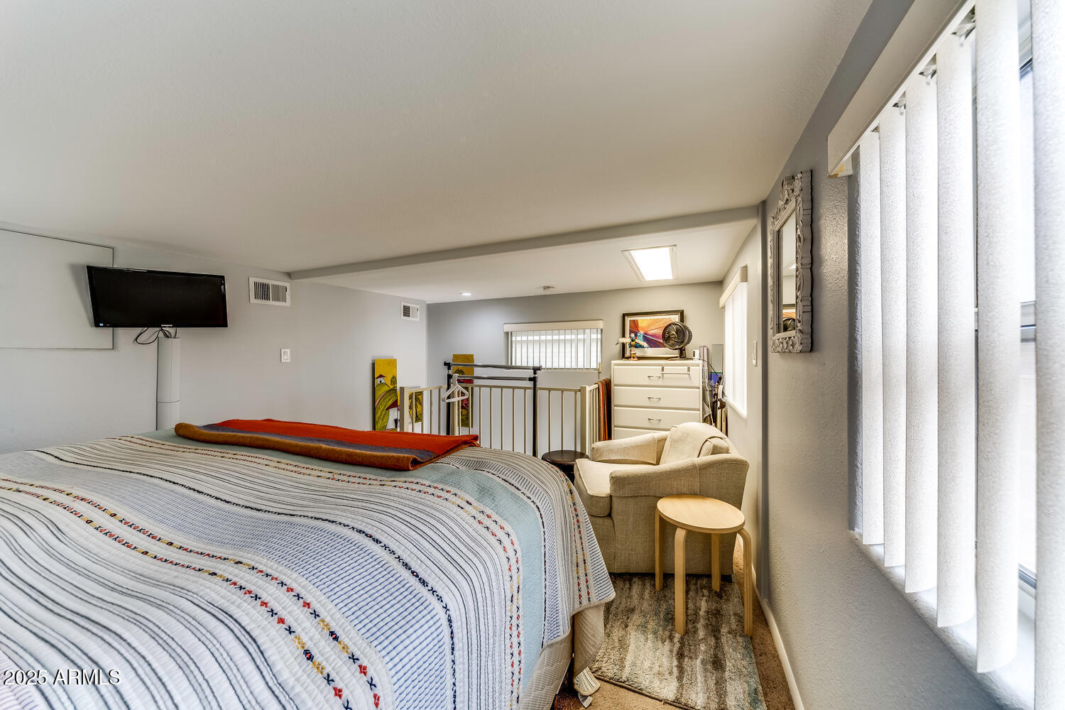 17200 West Bell Road, Unit 1770 Surprise, AZ 85374 - Photo 22 of 36 a bedroom with a bed and a view of balcony