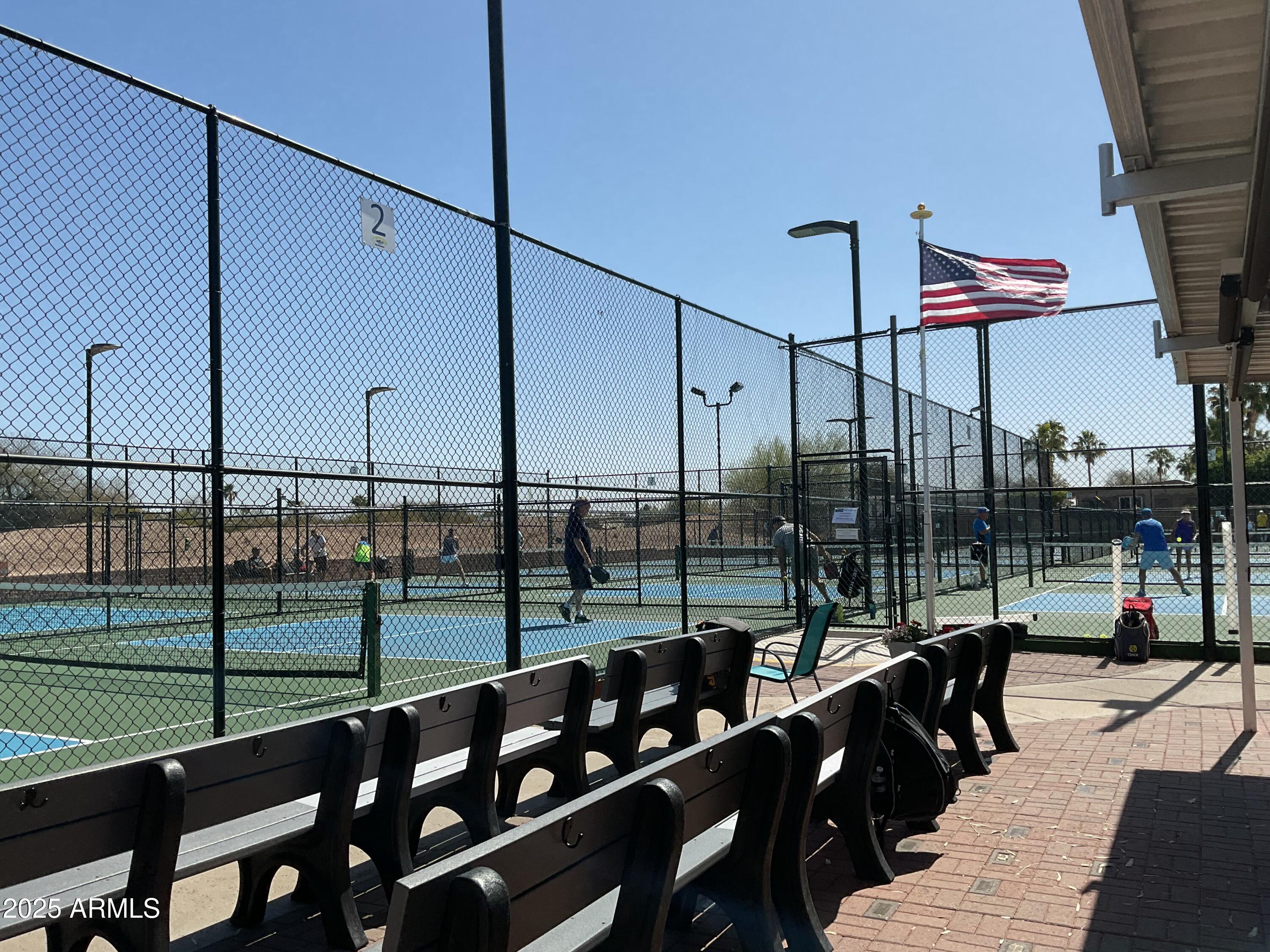 17200 West Bell Road, Unit 1770 Surprise, AZ 85374 - Photo 26 of 36 a view of a balcony with chairs and iron stairs