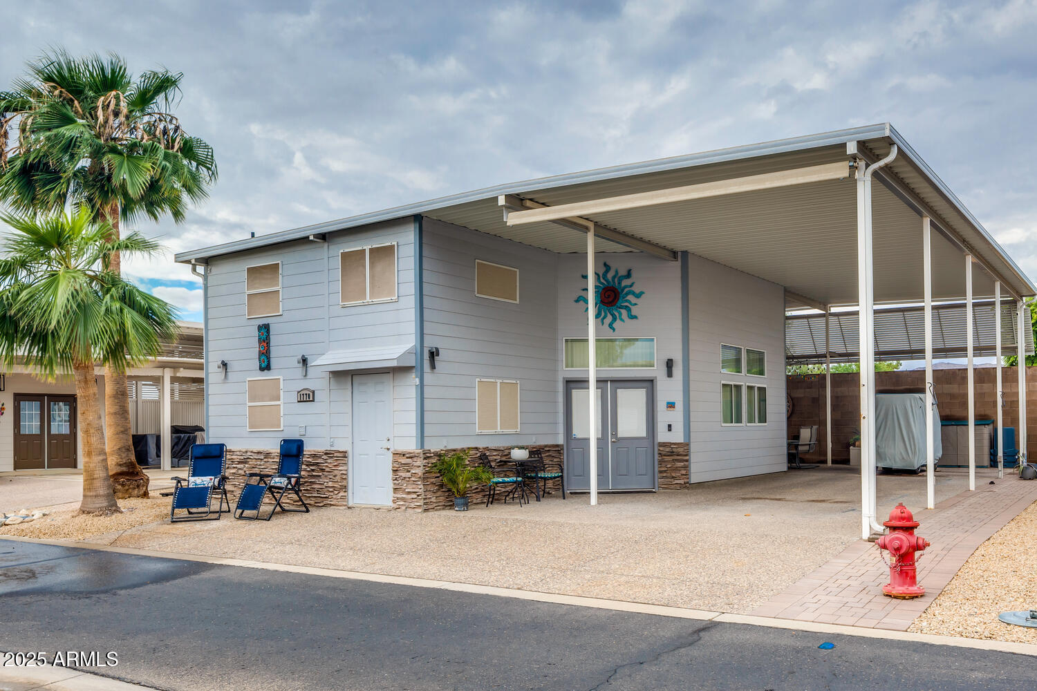 17200 West Bell Road, Unit 1770 Surprise, AZ 85374 - Photo 3 of 36 a front view of a house with a garage