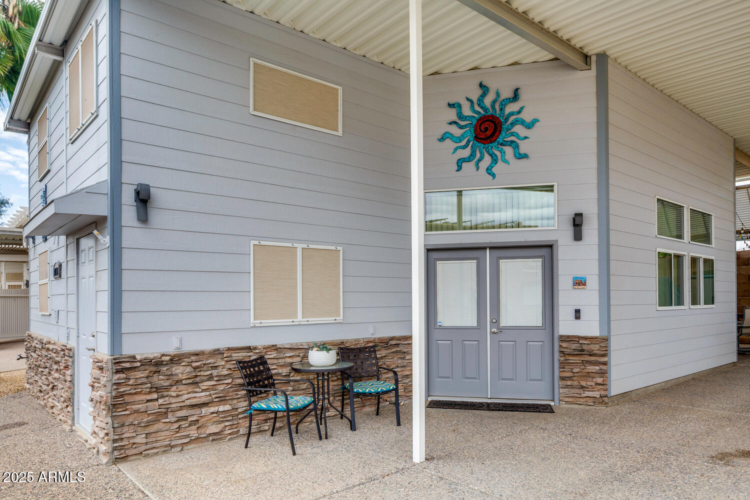 17200 West Bell Road, Unit 1770 Surprise, AZ 85374 - Photo 4 of 36 a front view of a house with outdoor seating