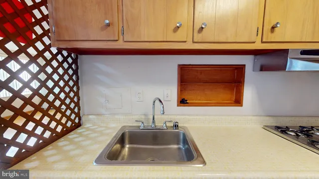 a kitchen with a sink and cabinets