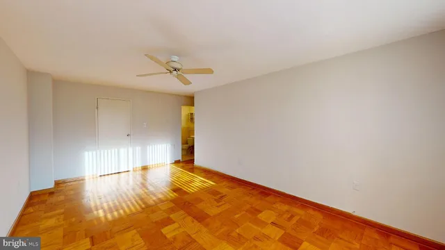 a view of a room with a ceiling fan