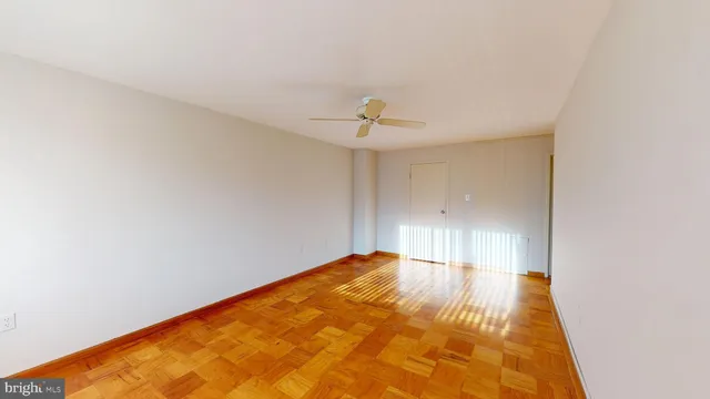 a view of a room with wooden floor
