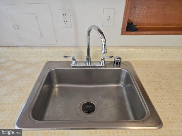 a kitchen with stainless steel appliances granite countertop a refrigerator and a stove