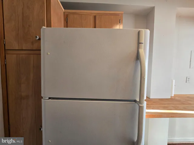 a view of a room with window and furniture