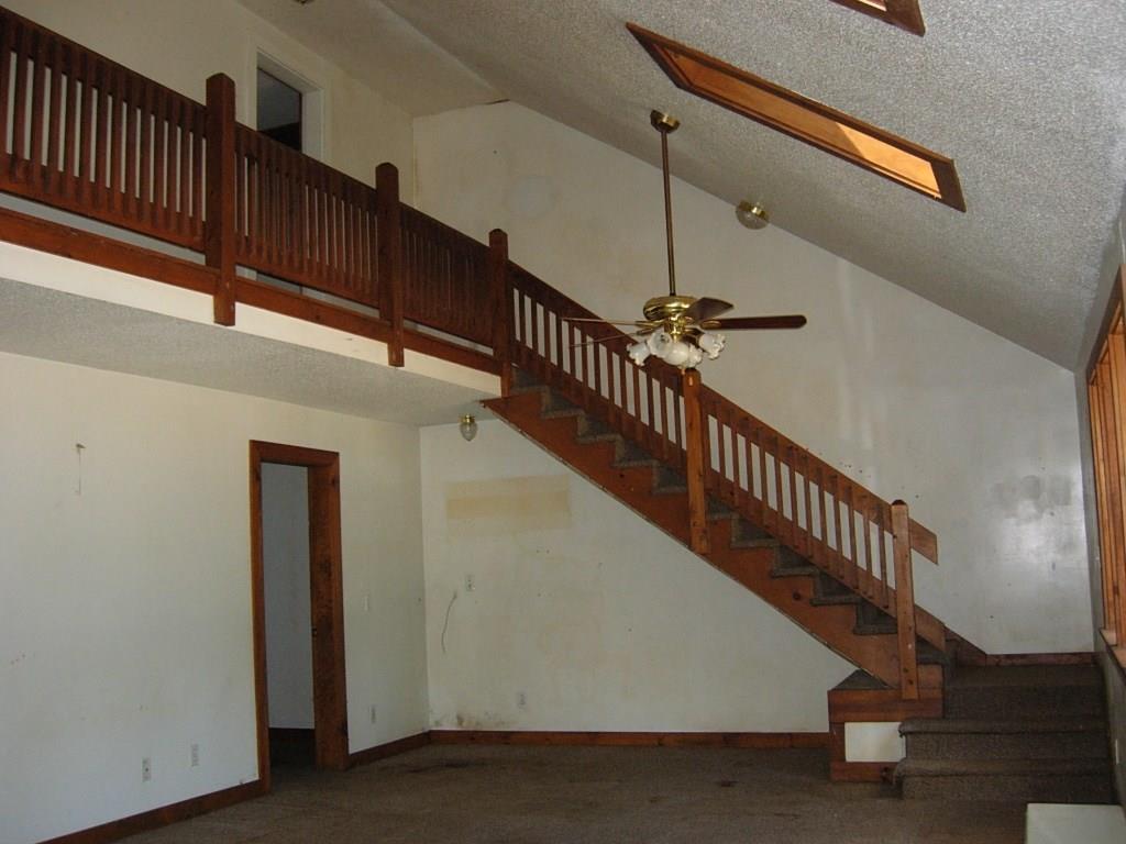 1562 Hudson Road Glenburn, ME 04401 - Photo 6 of 20 Living Area. Bedroom door visible