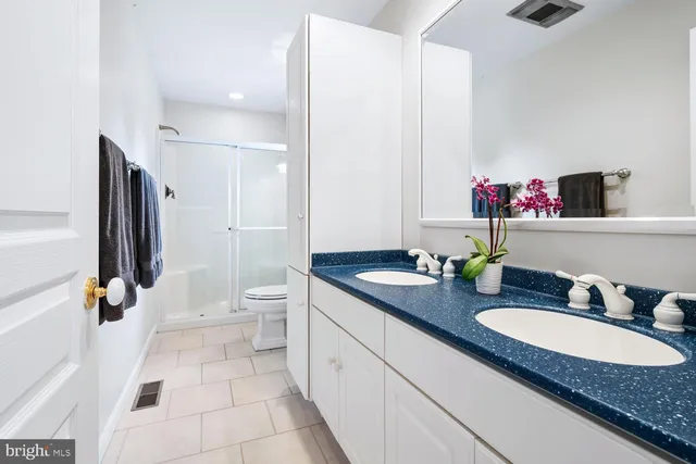 a bathroom with a tub and shower