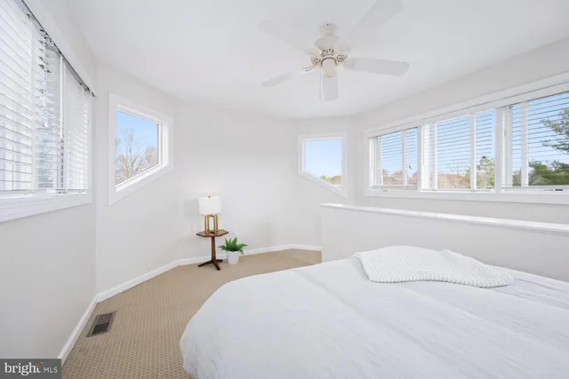 a kitchen with granite countertop a sink stove and cabinets
