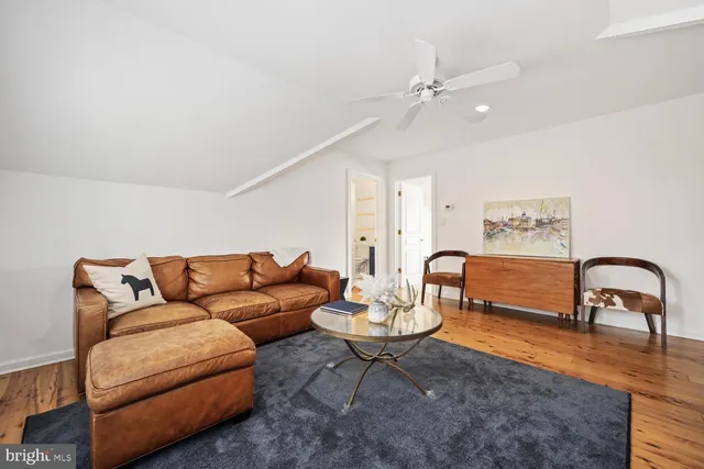 a view of a patio with table and chairs and wooden floor