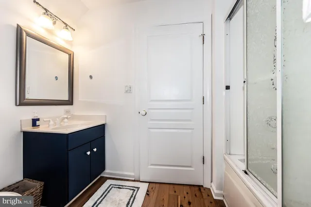 a view of a lake with boats and trees all around