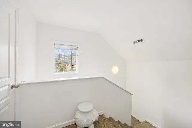 an outdoor space with swimming pool and furniture