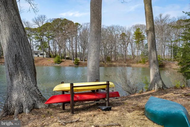 a view of a wooden deck with lake view