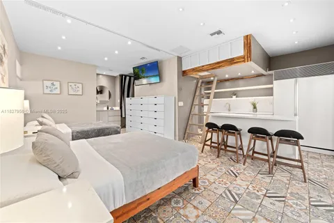 a bedroom with a bed and a desk