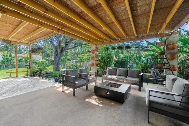 a outdoor living space with furniture and garden view