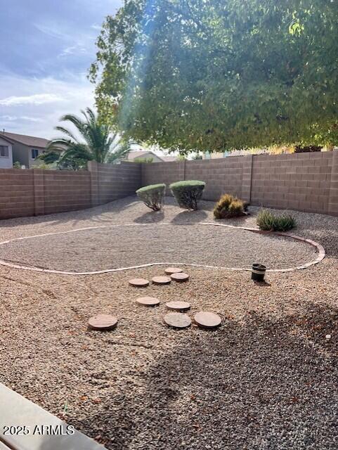 28314 North Crimm Road San Tan Valley, AZ 85143 - Photo 16 of 16 a view of a backyard with table and chairs