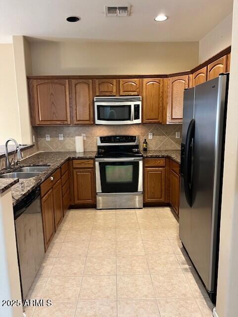 28314 North Crimm Road San Tan Valley, AZ 85143 - Photo 3 of 16 a kitchen with stainless steel appliances granite countertop a stove a sink dishwasher and a refrigerator