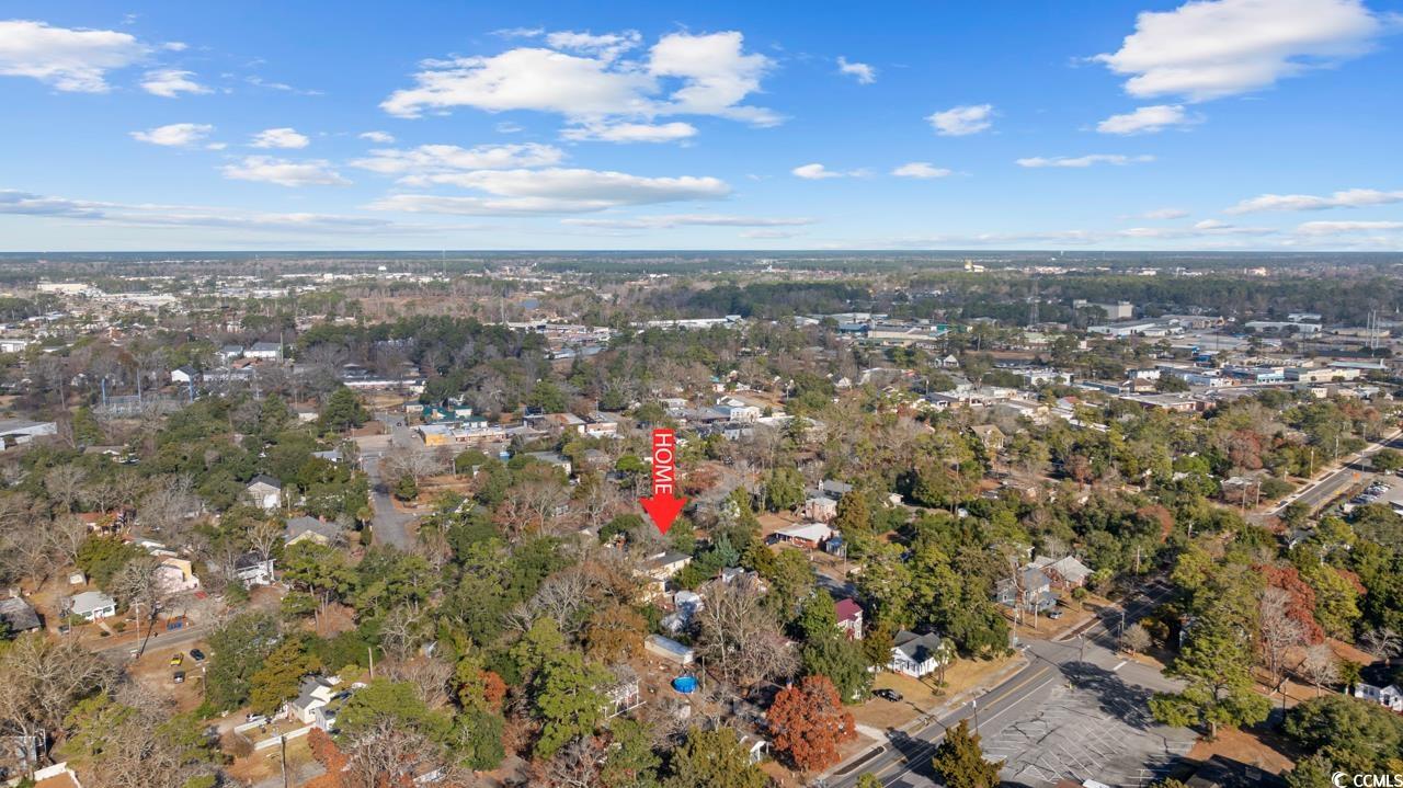 611 4th Avenue North Myrtle Beach, SC 29577 - Photo 2 of 15 Aerial view of property's location with a tree filled landscape