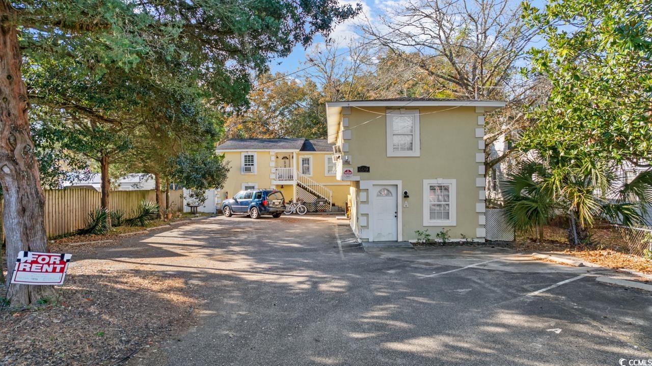 611 4th Avenue North Myrtle Beach, SC 29577 - Photo 3 of 15 Back of property featuring stairs and uncovered parking