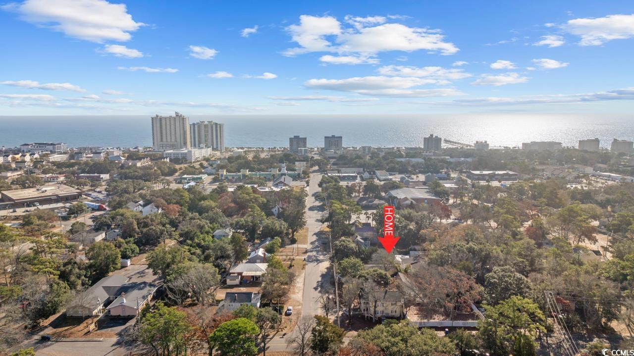 611 4th Avenue North Myrtle Beach, SC 29577 - Photo 6 of 15 Aerial view of property and surrounding area featuring nearby urban area and a large body of water