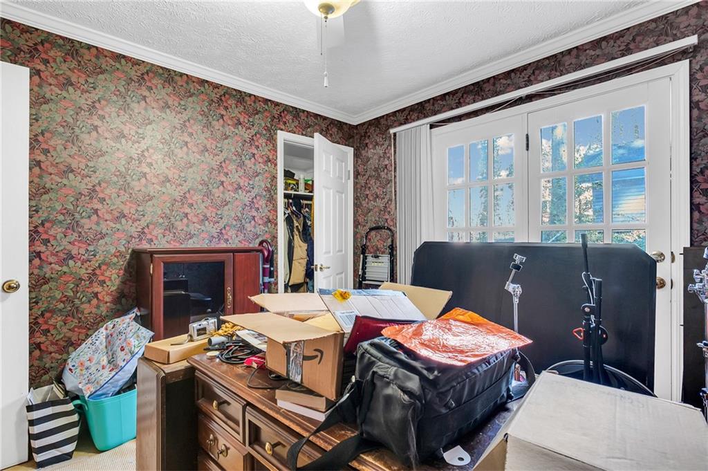 2894 McPherson Road Northeast Roswell, GA 30075 - Photo 16 of 24 a living room with furniture a fireplace and a flat screen tv