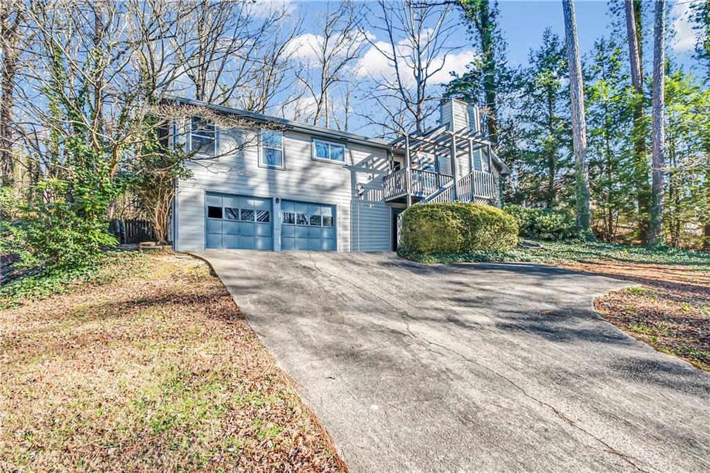 2894 McPherson Road Northeast Roswell, GA 30075 - Photo 2 of 24 a view of large house with a yard