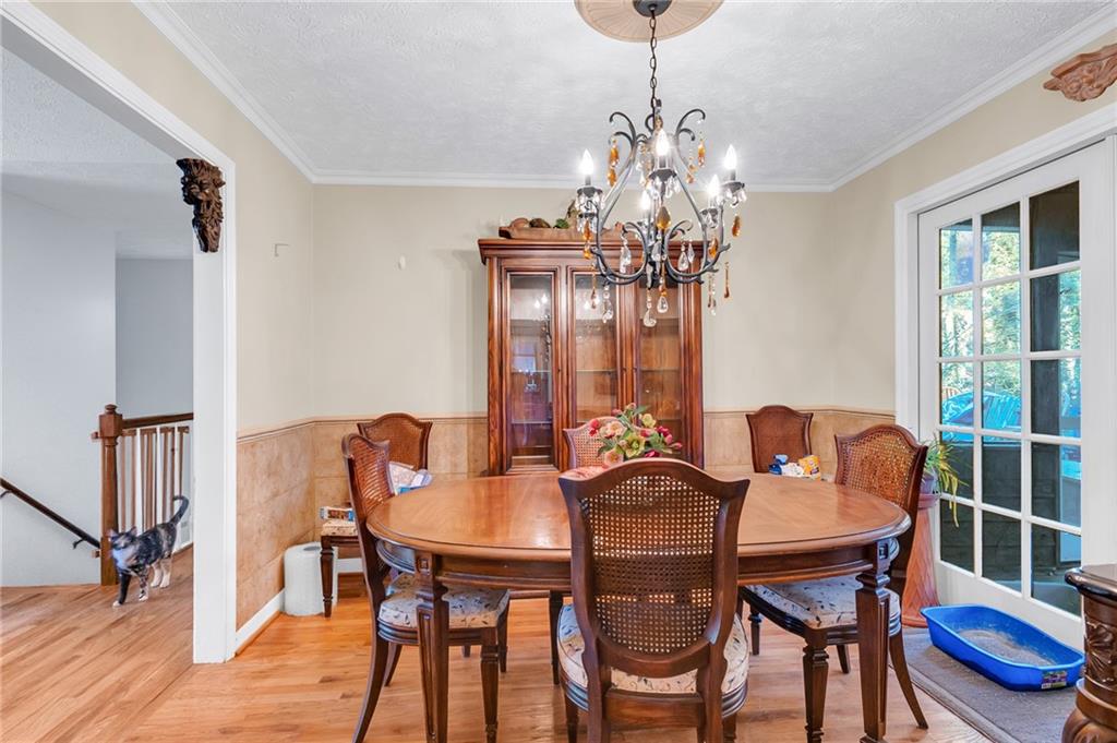 2894 McPherson Road Northeast Roswell, GA 30075 - Photo 6 of 24 a view of a dining room with furniture window and wooden floor