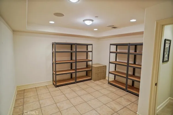 a bedroom with a balcony a bed and a flat screen television