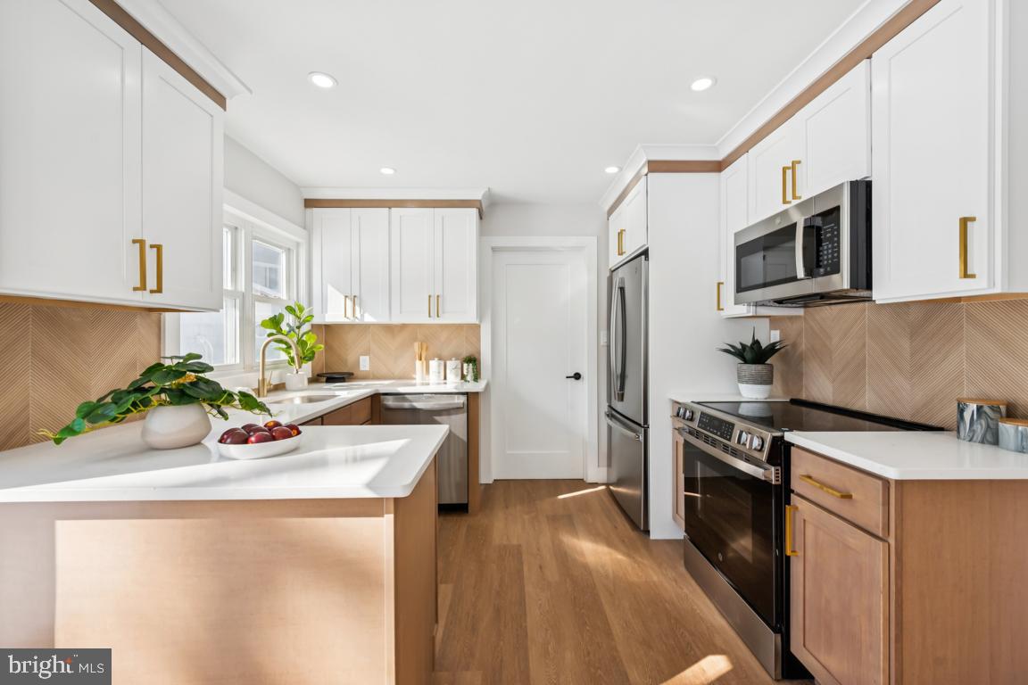 2 Sylvan Lane Willingboro, NJ 08046 - Photo 11 of 26 a kitchen with stainless steel appliances granite countertop a sink stove and refrigerator