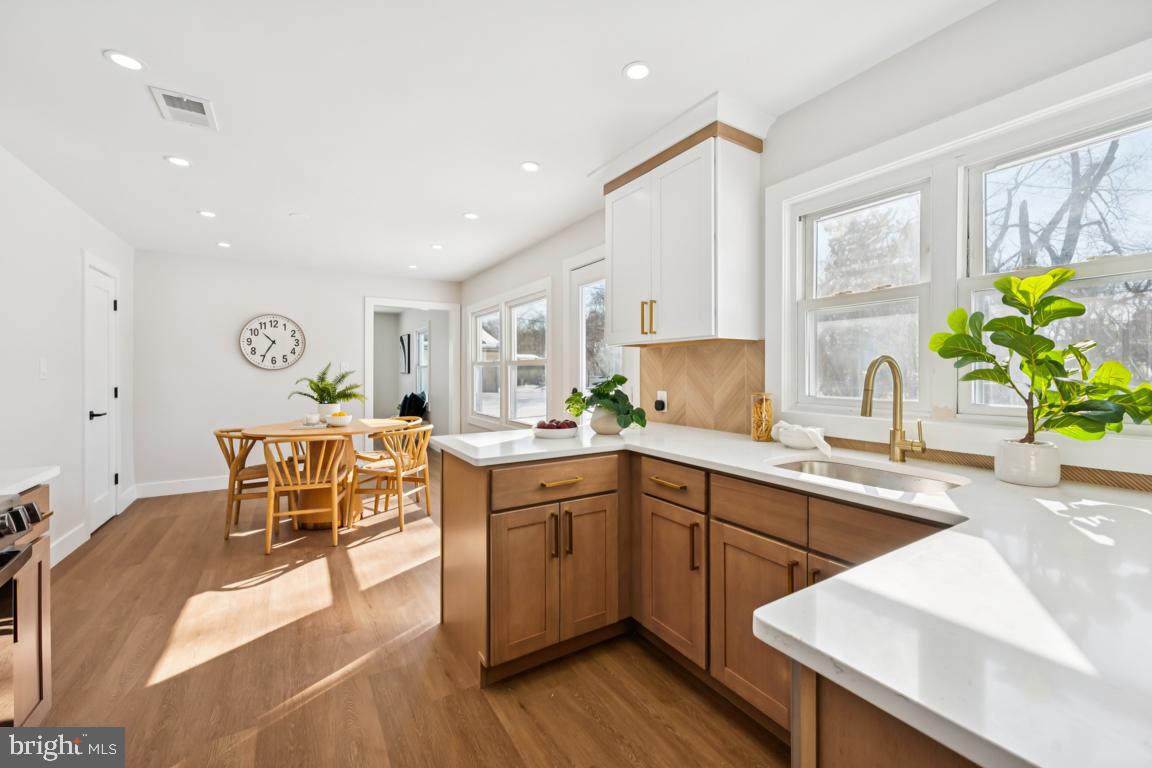 2 Sylvan Lane Willingboro, NJ 08046 - Photo 13 of 26 a large kitchen with cabinets table and chairs